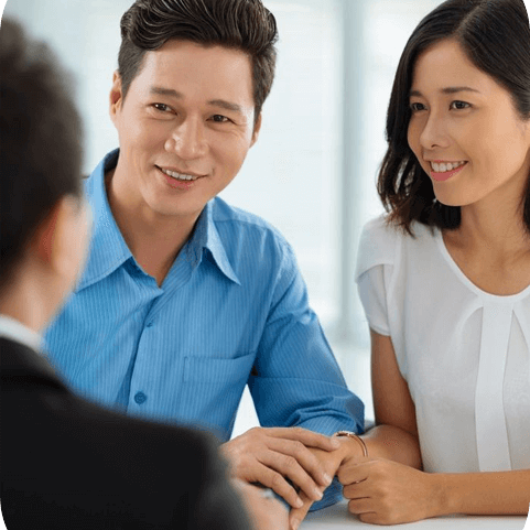 Asian married couple at the meeting with real estate agent